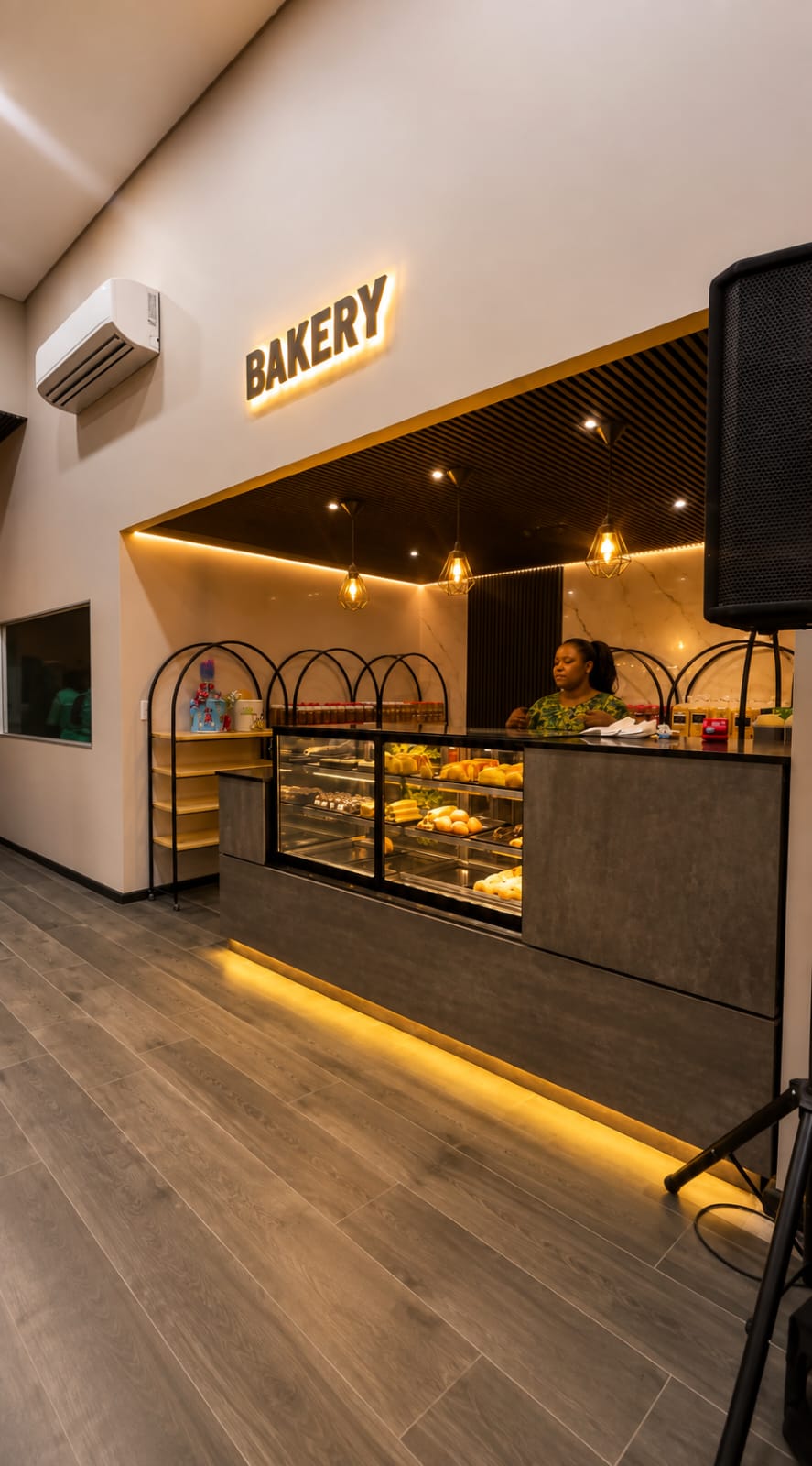 Bakery counter with a slatted timber ceiling feature and cove lighting