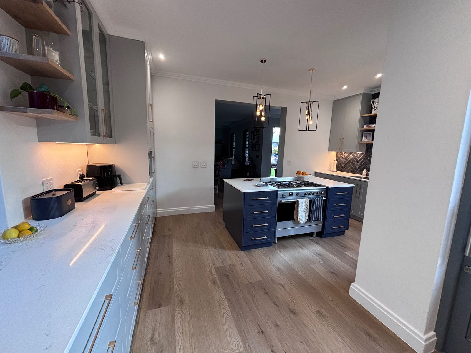 Interior painting across kitchen walls and ceiling with cornice lines