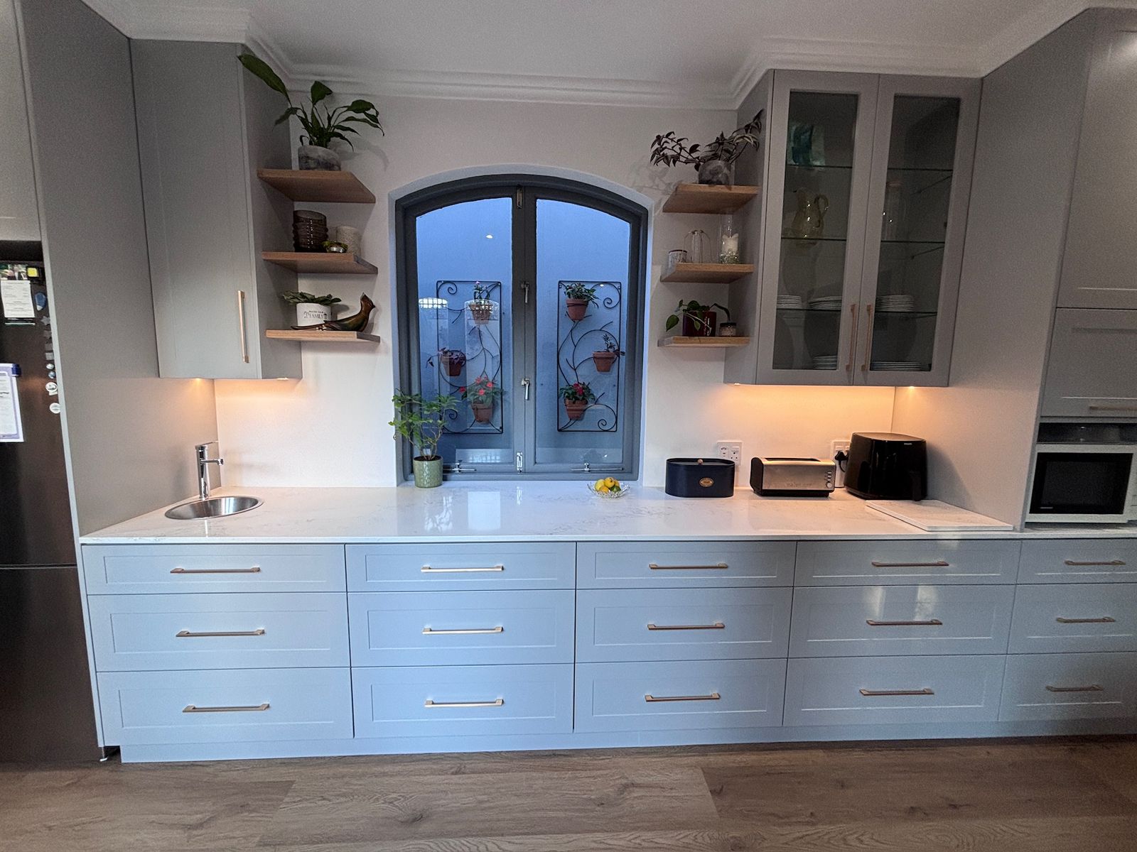 Painted cabinetry and cornice detail in a finished kitchen