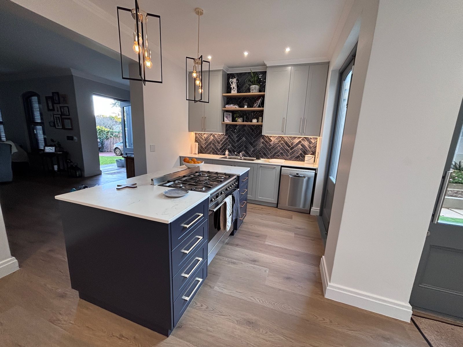 Laminate flooring laid through a kitchen and dining area